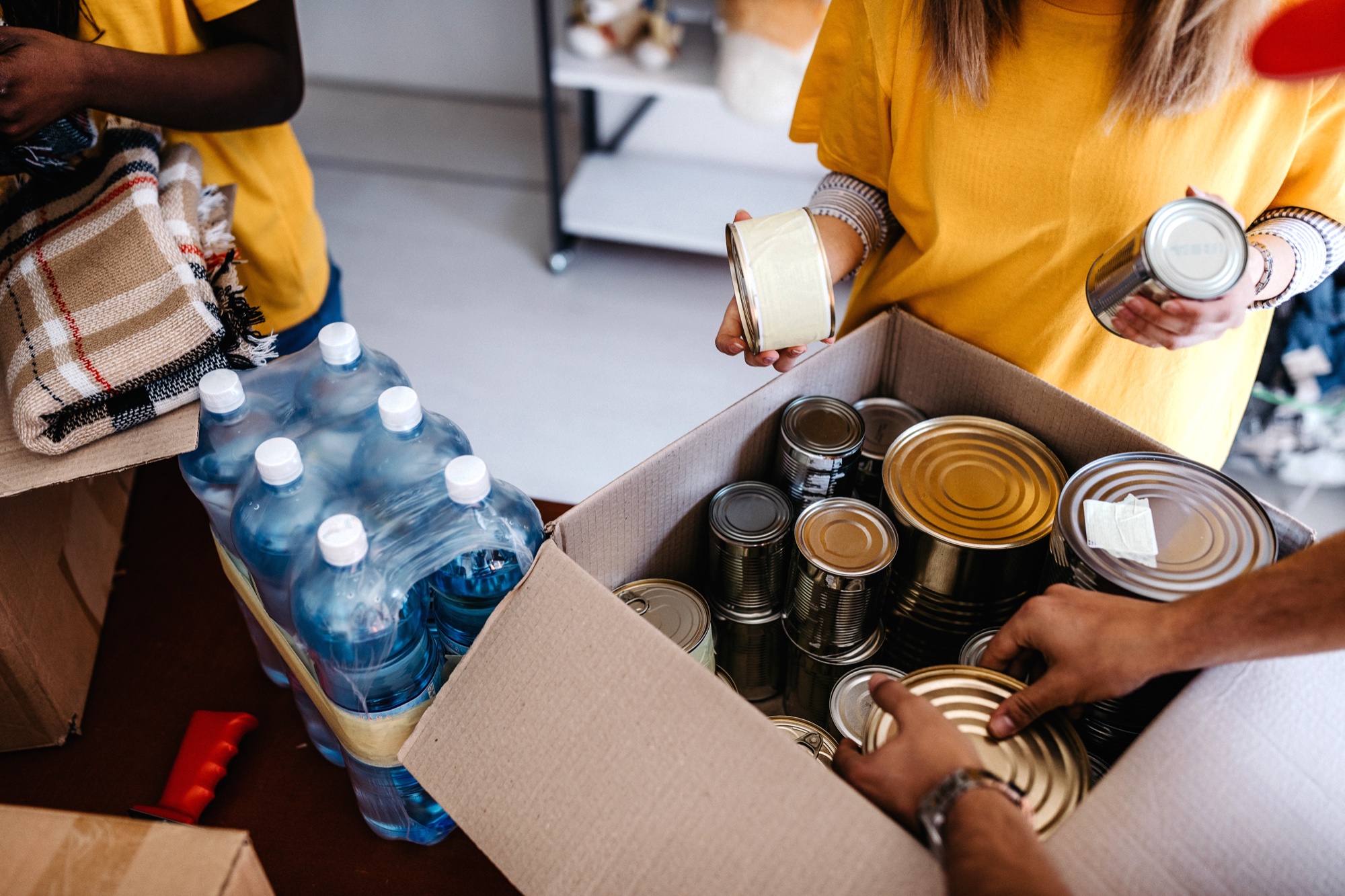 Volunteers packing food for the Food Ministry