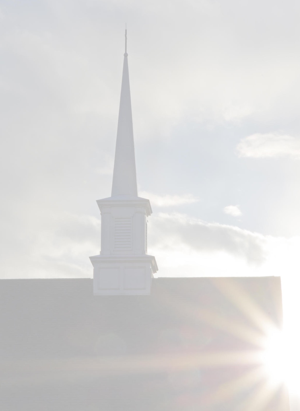 Sun-flare over the steeple at First Congregational Church of Clarkston